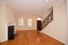 Living area Enter living room through solid wood front door on to gorgeous solid oak wood flooring; wood burning fireplace; authentic wooden plantation shutters throughout.