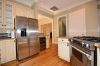 Kitchen High end appliances;granite counter tops on counters and island; designer stainless refrigerator and wine cooler included.